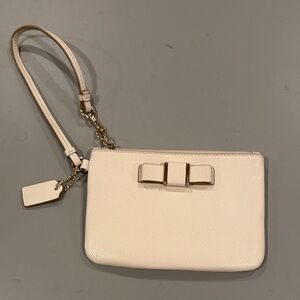Coach Cream Wristlet with Gold Bow Accent